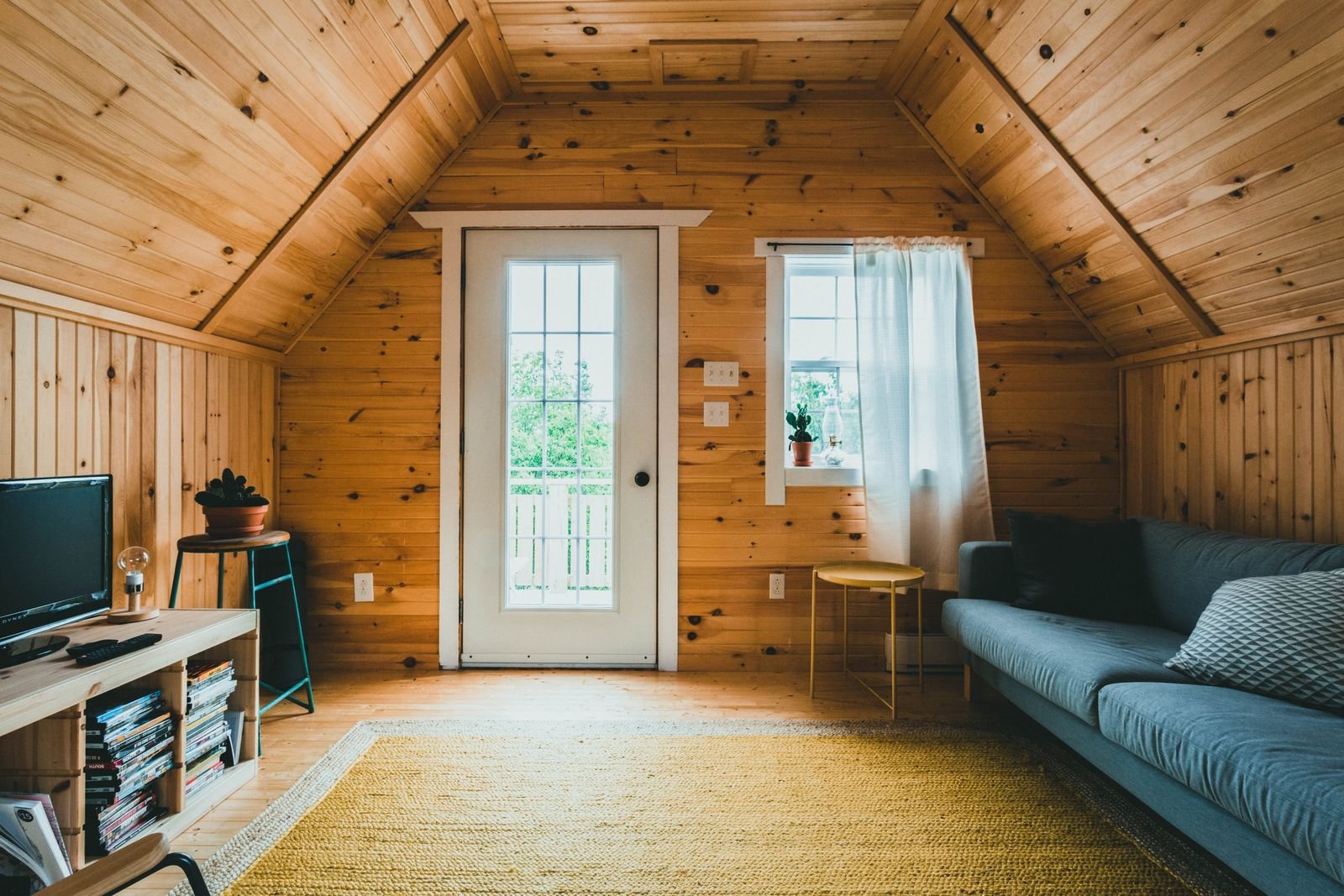Warm wooden interior of a small dwelling with natural light