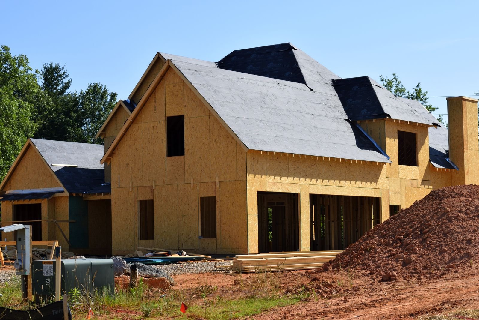 Partially built wooden house under construction